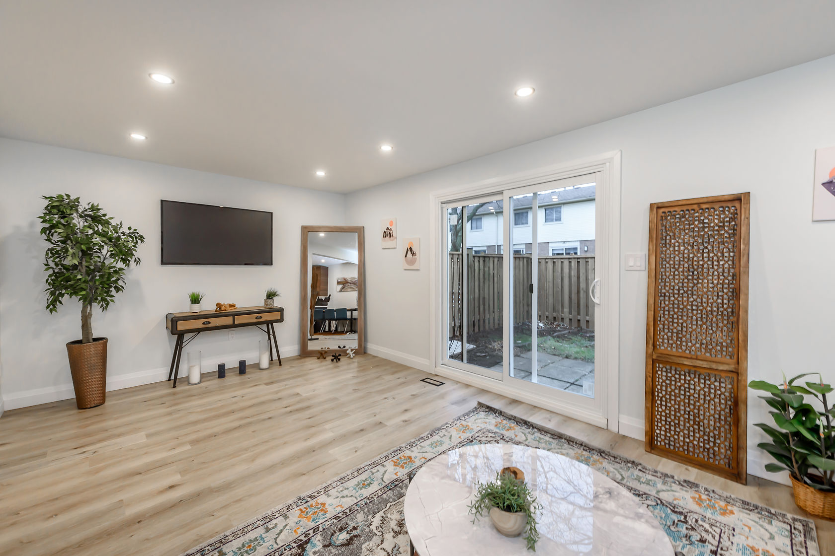 Bright, professionally staged living room with beautiful wood floors and clean modern finishes — Gateshead, Hamilton | MTC Renovations